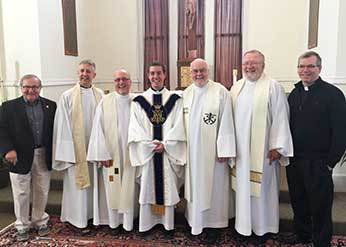 Fr Chase with fellow CSCs at King's College