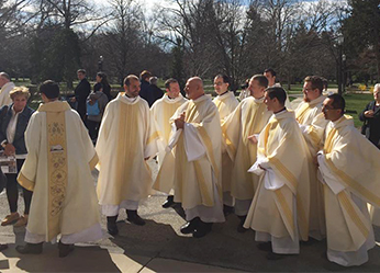 Holy Cross Priests Outside The Basilica