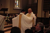 Fr Vince Kuna, CSC vested by his pastor Fr Bob Epping, CSC at Ordination