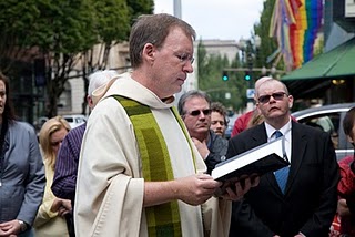 Fr Ron Raab, CSC leading prayer on the street