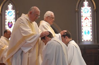 hands laying ordination priests concelebrating lay candidate rite then head week